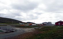 View of Hasvik Airport, with Wideroe Dash 8-100 aircraft on take-off roll